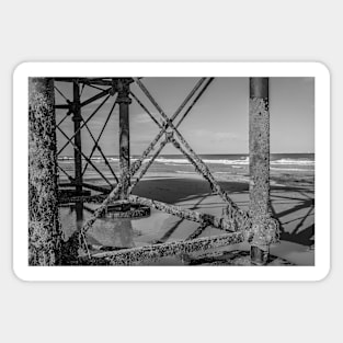 Jetty metal work on a sandy beach Sticker